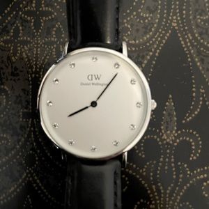 Daniel Wellington black wristband watch.